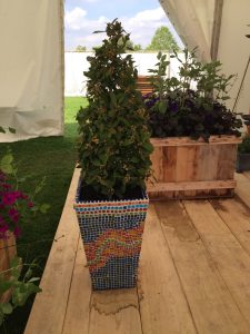mosaic pots by Hannah Genders aged crate planter in the background RHS Spring Festival Malvern