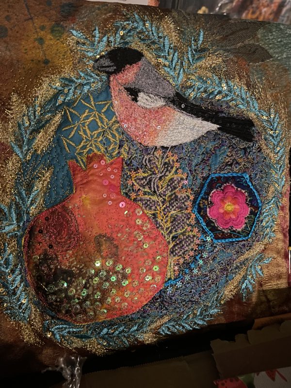 Bullfinch and pomegranate embroidered wall art by Nicky Perryman