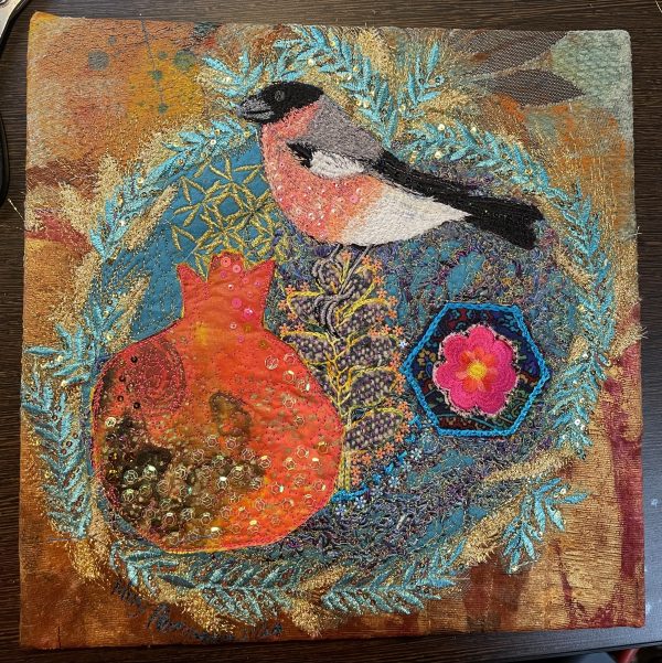 Bullfinch and pomegranate embroidered wall art by Nicky Perryman